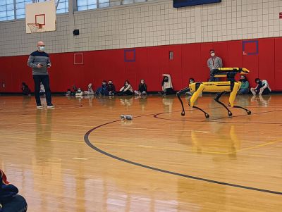 Spot
Kevin Garell from Boston Dynamics brought a robot named "Spot" for a lively demonstration at Rochester Memorial School. With assistance from his son Gavin, Mr. Garell showed off some of Spot's "training" and capabilities. The demonstration was the culmination of a series of projects during which Grade 6 students took on a challenge from NASA to design robotic devices with specific functions. The visit and associated lessons were coordinated by Grade 6 teachers Photo courtesy Erin Bednarczyk

