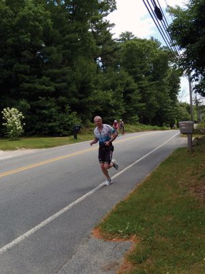 Riders and runners navigated overlapping courses on North Street in Rochester during the Patriot Half Triathlon held on June 15. Photos by Mick Colageo
