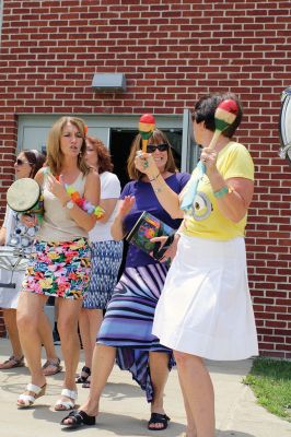Last Day of School
June 19 was the last day of school at RMS, and the teachers and staff celebrated with their traditional student sendoff. Conductor Danni Kleiman led the teachers in song as the busses full of waving students looped around the parking lot before heading off toward summer break. Photos by Jean Perry
