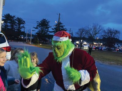 Rochester Tree Lighting
Santa was in Rochester last weekend! Both Santa and the Grinch were present, along with residents of the Tri-Town to take part in Rochester’s tree lighting on November 30. The rain was heavy but the hearts light. Photo by Michael J. DeCicco

