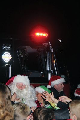 Rochester Christmas Tree
The town enjoyed a beautiful Monday evening and a large turnout, as children gathered on the steps of Town Hall to sing carols, and Santa Claus arrived with a Fire Department escort to hand out candy canes. Photos by Mick Colageo
