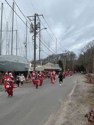 Mattapoisett Santa Stampede
The Mattapoisett Santa Stampede took place on Saturday, December 6 with over 300 Santas taking place. The 5K began at Shipyard Park and cut down Ned’s Point Road to the point, around the lighthouse and back. The Grinch led the pack on his bike, and residents stood by to cheer on all the runners. Photos by Sam Bishop and Mick Colageo
