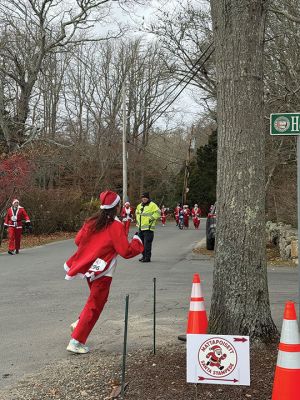 Mattapoisett Santa Stampede
The Mattapoisett Santa Stampede took place on Saturday, December 6 with over 300 Santas taking place. The 5K began at Shipyard Park and cut down Ned’s Point Road to the point, around the lighthouse and back. The Grinch led the pack on his bike, and residents stood by to cheer on all the runners. Photos by Sam Bishop and Mick Colageo
