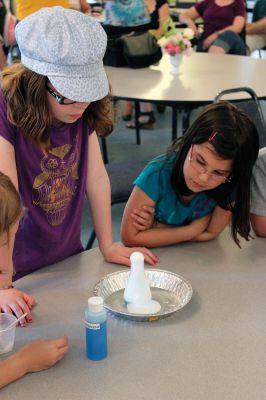 Mad Scientist
 The Joseph H. Plumb Library in Rochester kicked off their summer reading program entitled “Dig Into Reading” last Friday evening at the Congressional Church, where “Mad Scientist” Laser Leigh presented a group of K-6 graders from the Tri-Town area with several scientific experiments and an informative-yet-fun lecture on the wide scientific world. Photos by Nick Walecka. 

