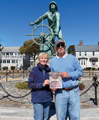 Cape Ann
Mary Dermody and Lar Kupferschmidt of Mattapoisett traveled last week to the "other Cape" in Massachusetts, Cape Ann, where they held up a Wanderer in front of the Fisherman's Memorial on the Gloucester waterfront. Courtesy photo.
