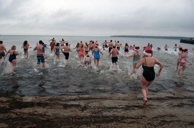 Christmas Day Swim
On Tuesday, December 25, many Tri-Town residents braved the chilly temperatures and jump into Mattapoisett Town Beach for the 12th Annual Christmas Day Swim.  All of the proceeds benefitted the Helping Hands and Hooves organization, which provides therapeutic horseback rides to people with disabilities.  Photo by Felix Perez. 
