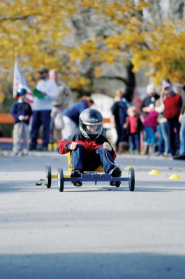 Speed Racers
Under the direction of Will Poirier, the Marion Pack 32 held their annual Soapbox Derby on Sunday, November 13 on Holmes Street. All the dens built their own cars this year. Photo by Felix Perez. November 17, 2011 edition
