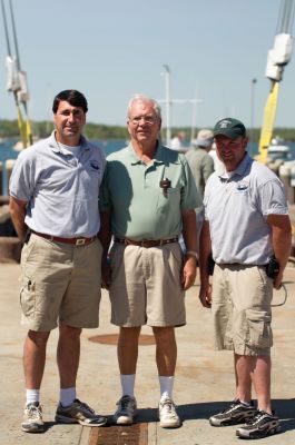 M/V Mattapoisett 
Dave Kaiser, Art McLean and Chad Santos pose during the christening ceremony of the M/V Mattapoisett, named in honor of Karl Collyer. Photo by Felix Perez. 
