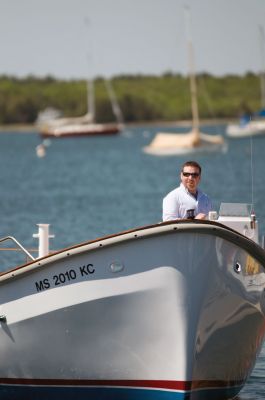 M/V Mattapoisett 
Evan Collyer, aboard the M/V Mattapoisett named in honor of his father and former harbormaster Karl Collyer who passed away in February 2010. Photo by Felix Perez.
