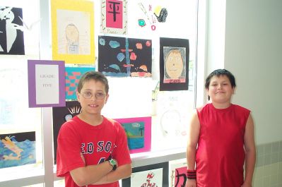 Old Hammondtown Origami Masters
Old Hammondtown School fifth graders Alex Moceri (left) and C.J. Faison (right) pose with some of the artwork they recently completed for the Mattapoisett schools annual art show. Both students collaborated to fashion over 200 origami cranes as part of teacher Diane Perrys Cranes for Peace project, which recently met an impressive goal of 1,000 handmade paper cranes. (Photo by Kenneth J. Souza).
