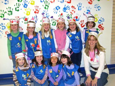 Girl Scout Support
Members of Marions Daisy Girl Scout Troop 67 (pictured here with Troop Leader Stacy Soucy) have each adopted a soldier stationed overseas in order to send them a care package each month. Among the items the girls have been sending are basic toiletries, cards, books, puzzles and nonperishable food items. The most recent packages included Valentines Day cards and Girl Scout cookies. (Photo courtesy of Stacey Soucy).

