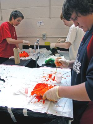 Tie-Dyed at ORR
Students in Ms. Gauvins eighth grade science class at Old Rochester Regional Junior High School learned about chemical reactions and colors during a tie-dye shirt-making session held this past week. UMass Dartmouth Chemistry Professor Tobey Dills (right background) and members of the UMass Dartmouth Chemistry Club were on hand to supervise the proceedings. Each student made their own cotton tie-dyed shirt which they will wear to school as part of a planned Tie-Dyed Day. (Photo by Kenneth J. Souza).
