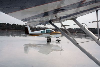 Frozen Flyers
A group of South Coast pilots recently took advantage of this winter's cold conditions to use Snipatuit Pond as a landing strip. The pilots use charts provided by the United States Government to determine if the thickness of the ice is enough to support the weight of their airplanes. Pilot Ben Bailey, who lives on the shores of the pond and hosted this past week's get together, flies a seaplane off of the pond during warmer weather months. (Photo by Robert Chiarito).
