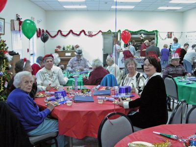 Rochester Rings in New Year
New Years Eve came early as the Rochester Council on Aging (COA) hosted their First Annual New Years Eve Party at the Rochester Senior Center on Friday, December 29. The revelers who attended the party were treated to everything one would expect in a New Years celebration. The occaision included music, bubbling drinks, streamers, party hats and a balloon drop and, there was even a master of ceremonies answering to the name Dick Clark! (Photo by Robert Chiarito).
