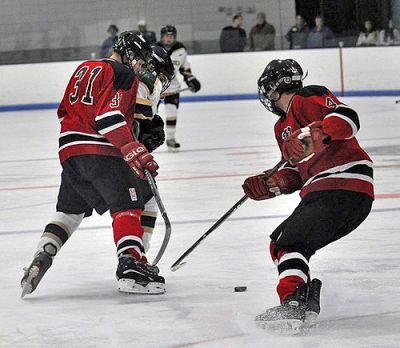 Power Play
Raymond Lawton and Brennan Goguen led the Old Rochester/Fairhaven Hockey Team to a 9-0 win over the Greater New Bedford Regional Vocational Technical High School Bears on the Bears home ice on Wednesday, January 7. Lawton netted three goals and assisted on another while Goguen scored two goals and assisted on three others as the Bulldogs ran their record 5-3-1 for the 2008-2009 season. (Photo by Tim Smith).
