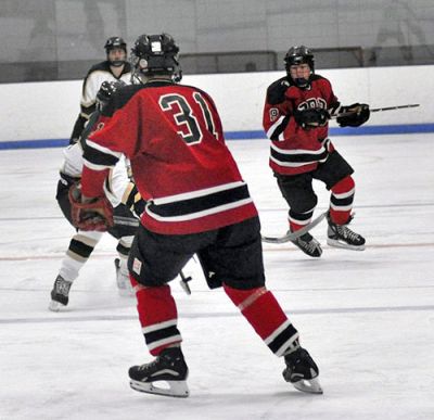 Power Play
Raymond Lawton and Brennan Goguen led the Old Rochester/Fairhaven Hockey Team to a 9-0 win over the Greater New Bedford Regional Vocational Technical High School Bears on the Bears home ice on Wednesday, January 7. Lawton netted three goals and assisted on another while Goguen scored two goals and assisted on three others as the Bulldogs ran their record 5-3-1 for the 2008-2009 season. (Photo by Tim Smith).

