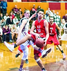 Old Rochester sophomore, Matt Valles, pulls in the tough rebound.