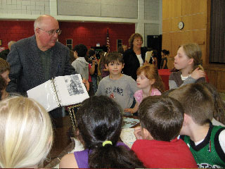 Rochester History
Rochester Historical Commission members presented a local history assembly to the 3rd grade a Rochester Memorial School. The presenters were, (top left)Fred Underhill displaying items from Stillwater Furnace, Henry Hartley showing pictures of local Native Americans, Cindy Underhill (spouse of RHC member) talking about the early cranberry industry, and Betty Beaulieu explaining about the early schools in Rochester and  Anna White showing artifacts from early churches, food and dress.
