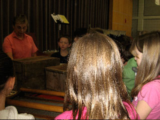 Rochester History
Rochester Historical Commission members presented a local history assembly to the 3rd grade a Rochester Memorial School. The presenters were, (top left)Fred Underhill displaying items from Stillwater Furnace, Henry Hartley showing pictures of local Native Americans, Cindy Underhill (spouse of RHC member) talking about the early cranberry industry, and Betty Beaulieu explaining about the early schools in Rochester and  Anna White showing artifacts from early churches, food and dress.
