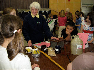 Rochester History
Rochester Historical Commission members presented a local history assembly to the 3rd grade a Rochester Memorial School. The presenters were, (top left)Fred Underhill displaying items from Stillwater Furnace, Henry Hartley showing pictures of local Native Americans, Cindy Underhill (spouse of RHC member) talking about the early cranberry industry, and Betty Beaulieu explaining about the early schools in Rochester and  Anna White showing artifacts from early churches, food and dress.
