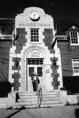 02-21-02
Patricia Broughton of Acushnet Road in Mattapoisett and her Yorkie, Teacup, pose outside the Bridgetown Town Hall during a recent trip to Nova Scotia. 02/21/02 edition

