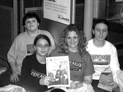 020504
Stuck in Chicago ... this family recently took a vacation over the holidays and got stuck in Chicagos notorious OHare Airport for 27 hours on their way back. Luckily, Paul Keane (their great uncle) remembered to bring this copy of The Wanderer with him just for the photo-op. They were hoping to get a shot on top of Donner Summit in the Sierras, but that didnt work out. Pictured here are Garrett Bauer, Kayla Souza, Holly Smith and Kerrin Souza. (Photo by and courtesy of Tim Smith). 2/5/04 edtion
