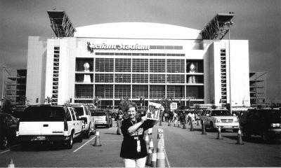 021204
Fairhaven resident and school employee Diane Lopes poses here with a copy of The Wanderer just outside Reliant Stadium in Houston, TX where she was lucky enough to witness first-hand the New England Patriots second Super Bowl championship win on Sunday, February 1. (Photo by and courtesy of Kim Lopes). 2/12/04 edition
