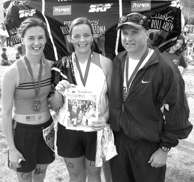 021904
Nicole (Lambalot) Cameron, Lizzy (Lanagan) Adams, and Gerald Lanagan pose with a copy of The Wanderer at the finish line of the Rock and Roll Marathon recently held in Phoenix, Arizona on January 11. Nicole and Lizzy live in Mattapoisett, and Gerald is stationed at Luke Air Force Base in Phoenix. (Photo by and courtesy of Nancy Lambalot). 2/19/04 edition
