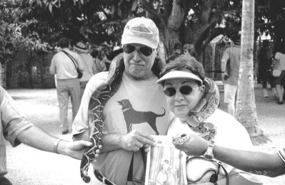 04-18-02-4
Mike and Elaine Jennings of Mattapoisett and a slithering friend (a possible former mate of rock star Alice Cooper) posed with a copy of The Wanderer while on a recent cruise to the Mangrove Swamps of La Restina Lagoon on Margarita Island in Venezuela. 4/18/02 edition
