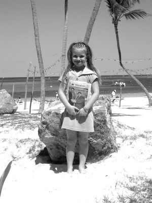 040705-1
Hannah Elizabeth Lafreniere, daughter of Peter and Pamela Lafreniere of Mattapoisett and granddaughter of John and Veronica Lafreniere of Rochester, poses with a copy of The Wanderer on a scenic beach in the Dominican Republic during a recent vacation with her parents and grandparents. (Photo courtesy of Veronica Lafreniere). 4/7/50 edition
