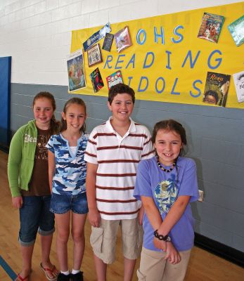 Book Smart
Old Hammondtown School in Mattapoisett recently completed their first-ever Reading Idol program which began in February. Students were given incentive raffle tickets for every hour of extracurricular reading they did which could be exchanged for chances to win various prizes during a school assembly held on Friday, June 1. Pictured here (l. to r.) are the Top Four winners of this years Reading Idol contest: Rose Haznar (Grade 6, second place); Kristin Nascimento (Grade 6, first place); Lenny Murphy (Grade 5, fourth place); and Jackie Dyson (Grade 4, third place). (Photo by Kenneth J. Souza).
