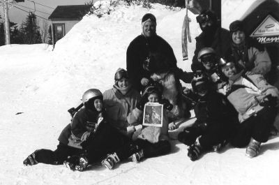 071504-4
The Anderson and Kelleher families of Marion spent their recent winter vacation skiing Mont Sainte Anne in Quebec. Here they pose atop the mountain with a copy of The Wanderer and a Saint Bernard named Maggie (center). 7/15/04 edition

