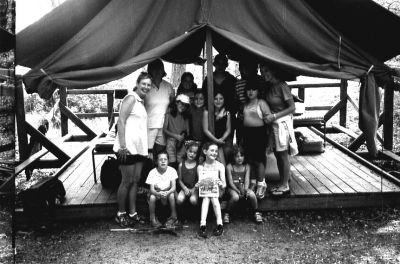 08-29-02
Members of Mattapoisett Girl Scout Brownie Troop #118 recently took an overnight camping trip to Wind-in-the-Pines in Plymouth, MA and remembered to take along a copy of The Wanderer with them, which they posed with here. Troop members pictured include: (seated front row, l. to r.) Alexandra Pickering, Alison Roney, Laura Ecklund, Katie Kiernan, (second row, l. to r.) Joanna MacDonald-Ingham (co-leader), Demitra Pickering, Scotlyn Adler, Amanda LeFabvre, Sofia Ellis, (back row, l. to r.) Carol Adler (leader), Camile Adler, Katherine Bernier (weekly volunteer), Mary Beth Kiernan (co-leader), and Patricia Monteiro-Pickering (co-leader). The troop enjoyed swimming, canoeing, camp fires, crafts, and much more! (Photo courtesy of Patricia Monteiro-Pickering). 8/29/02 edition
