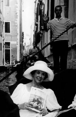 08-30-01-1
Luice Moncevitch, a teacher at Mattapoisetts Center School, recently traveled to Venice, Italy and took along a copy of The Wanderer with her which she posed with while enjoying a gondola ride through the citys famous water-filled canals. Ms. Moncevitch also traveled to see the Innsbrook remains of a mummy uncovered by hikers which are now on display at a museum in Balzano. 8/30/01 edition
