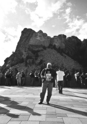 091604
Rochester Selectmen Chairman Gary Laboa poses with a copy of The Wanderer at the landmark Mount Rushmore in Rapid City, South Dakota during a trip last month to attend the 64th Annual Sturgis Motorcycle Rally in nearby Sturgis, SD. The annual event drew an estimated 514,000 bike enthusiasts and Mr. Laboa, a drummer with local act The Relics, met fellow musician and Rock and Roll Hall of Famer Billy Gibbons of ZZ Top at the rally. (Photo courtesy of Gary Laboa). 9/16/04 edition
