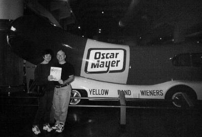 12-20-01
Could this be Dog Day Afternoon? No, its Alan and Toby Bulotsky of Mattapoisett, posing proudly with a copy of The Wanderer during a recent visit to the Henry Ford Museum in Detroit, Michigan. The museum is known for many exotic and unique vehicles, including this easily-recognizable product promoter. 12/20/01 edition
