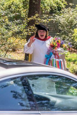 Reverend Amy Lignitz Harken
The Reverend Amy Lignitz Harken was serenaded at the end of her parsonage driveway by supporters who arrived in a motorcade shortly after her virtual graduation from Hartford Seminary with a doctorate degree in ministry. Lignitz Harken has been the pastor of Mattapoisett Congregational Church since 2011. See story. Photo by Ryan Feeney - May 21, 2020
