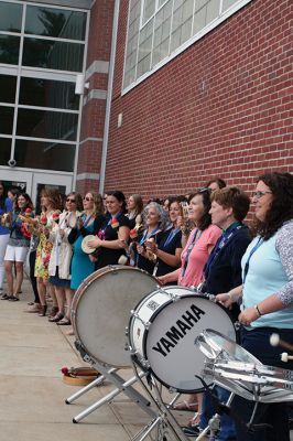 Sayonara, School! 
Dark clouds and raindrops couldn’t dampen the spirits of students and teachers on June 25 when Rochester Memorial School said farewell until next September. Bandleader Chris Williamson, along with teachers and Principal Derek Medeiros, sent the students on their way with the traditional rousing music. The musical fest-like last day of school has been taking place for more then 20 years, according to Williamson. Photos by Marilou Newell
