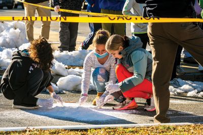 Crime Scene Investigation
Mattapoisett Police Detective Scott LeBlanc made an appearance at Old Hammondtown School on Friday, when Emily DeBortoli (Italia shirt) and many other fifth graders learned about investigating crime scenes outside the school building. Photos by Ryan Feeney
