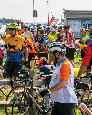 Cranberry Harvest Race
Participants in Sunday's Cranberry Harvest Race stopped at Mattapoisett Wharf to rest up and get some nourishment. The bike ride starting and finishing in Myles Standish State Forest in Plymouth also traveled through Carver, Rochester and Acushnet. Photos by Ryan Feeney
