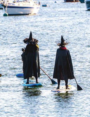 Wicked Paddle 
Paddleboarders took to the dark side on a cool Monday morning during the Wicked Paddle event held at Island Wharf in Marion. Photos by Ryan Feeney
