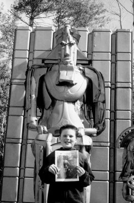 6-21-01-2
Alex Zarlengo, a sixth grade student at Old Hammondtown School in Mattapoisett, brought his copy of The Wanderer with him to Manchester, VT where he posed with a King Tut-inspired, Egyptian-looking scrap metal sculpture on the grounds of the Washburton Inn. 6/21/01 edition 
