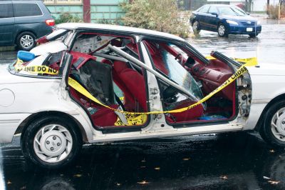 Extrication Practice
A mangled Ford Taurus stands outside the Mattapoisett fire station during the October 18 noreaster as a reminder to the public to drive safely. The car was used for an extrication demonstration done on the October 15 Fire Station Open House. Photo by Anne OBrien-Kakley
