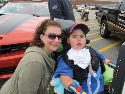 Ride for Alex
Event organizer Tammy Foisy poses with Alex Pateakos at the fifth annual Ride for Alex poker run on September 18, 2011. Ms. Foisy, a former nurse to Alex, coordinates the event each year with her husband Scott. Proceeds from the event offset costs, not covered by insurance, related to Alex's well-being. Photo by Shawn Sweet.
