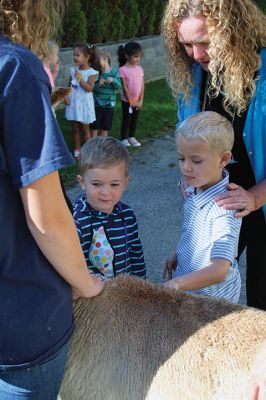 Good News
On October 14, Jeff and Lauren Paine of Pine Meadow Farms in Mattapoisett brought Alpacas “Good News,” a two-year-old male, and “Patience,” a 10-year-old female, to the Loft School in Marion, where Debbi Dyson's Pre-K class has been learning about Peru and the country’s alpacas and llamas. Pine Meadow will host an Open House on October 30. Photos by Mick Colageo
