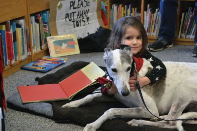 Amos, the reading greyhound
Amos, the reading greyhound, is now at home at the Plumb Library after over a year as Rochester’s newest literate dog. On Saturday, Autumn Simmons and her Dad Matt read several of Autumn’s favorite books to Amos who listened attentively, took a nap, and gave a thank you hug before leaving. Photos by Jean Perry
