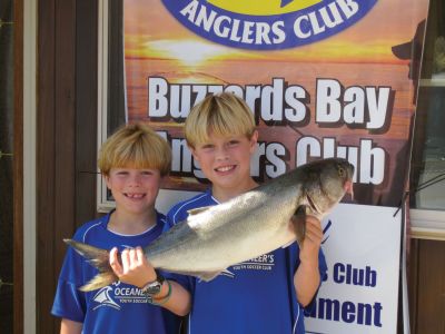 Angler Awards
Patrick and Seamus Fearons, ages ten and eight, the sons of past
President of the Buzzards Bay Anglers Club George Fearons, stand holding
their eight-and-a-half pound bluefish. Photo by Sarah K. Taylor

