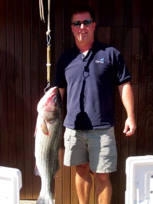 Angler Awards
Roy Strand holds up his twenty-two pound bass which he caught by
boat for the Buzzards Bay Anglers Club Fourth Annual Boat and Shore
Tournament. Photo by Sarah K. Taylor

