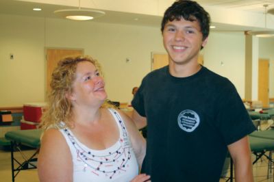 Blood Drive
Cheryl Randall and her son Pierce were among the volunteers and donors at the fifth annual Harbor Days Blood Drive. Ms. Randall spent her third year volunteering, while her 17-year-old son gave a double red cell donation, helping to save up to six lives with his one good deed. Photo by Anne Kakley.
