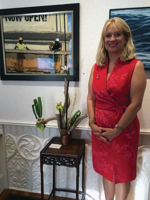 Art In Bloom
Cassy West, past president of the Marion Garden Group, stands beside her Ikebana-style floral arrangement at the June 8 Art In Bloom event at the Marion Art Center. Photo by Marilou Newell
